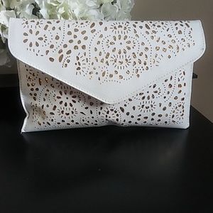 Oversized gold and white clutch